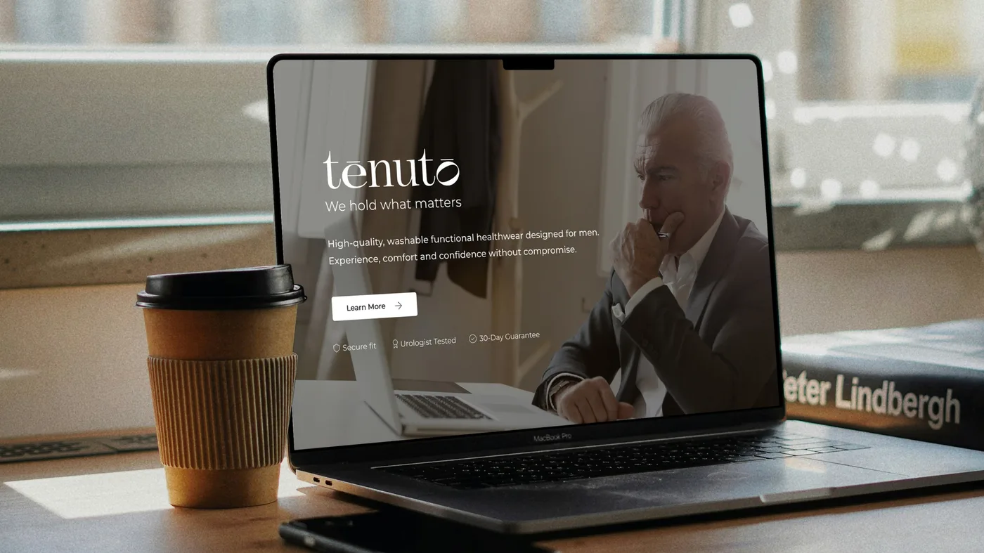 The desktop banner shown on a laptop on a café table